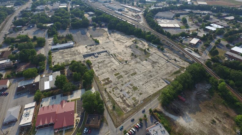 This aerial shows the old Fenner-Dunlop mill district in the center. But to the center-left lies the four acres owned by Avondale Estates, most of which is currently parking. The city’s Downtown Development Authority has created a “process map” for outlining definitive development plans regarding those four acres. Courtesy Avila Real Estate.