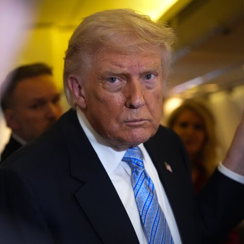 President Donald Trump speaks to reporters aboard Air Force One, Friday, May 15, 2026, as he returns from a trip to Beijing, China. (AP Photo/Mark Schiefelbein)