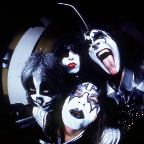 FILE - In this image taken with a fisheye lens, members of the rock group Kiss, clockwise from right, Gene Simmons,, Ace Frehley, Peter Criss and Paul Stanley pose before a concert in Hartford, Conn., Feb. 16, 1977. (AP Photo/Richard Drew, File)