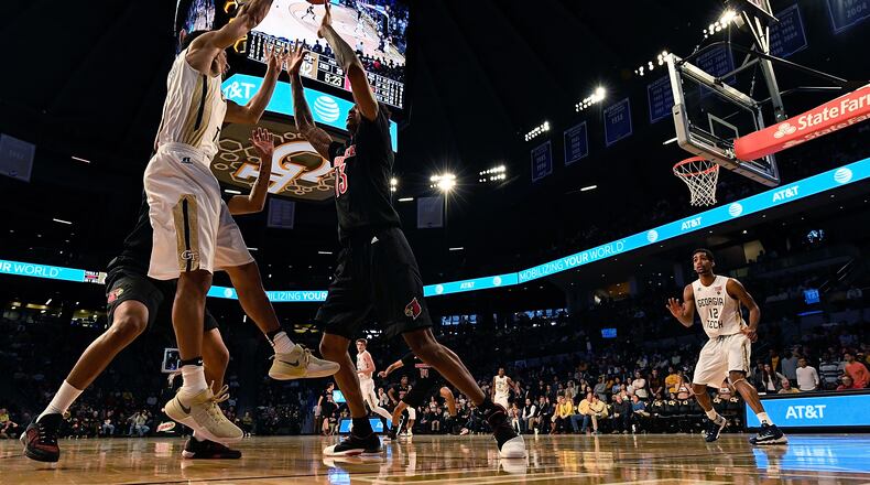 Josh Heath #11 of the Georgia Tech Yellow Jackets works to avoid a Louisville trap during the game at Hank McCamish Pavilion on January 7, 2017 in Atlanta, Georgia. (Photo by Mike Comer/Getty Images)