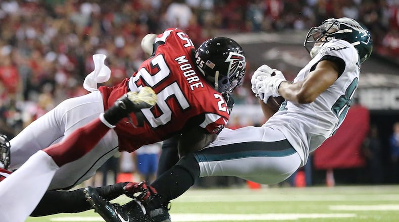 091415 ATLANTA: Falcons safety William Moore levels Eagles wide receiver Jordan Matthews with a hard hit as he pays the price for making a catch during their Monday Night Football game on Monday, Sept. 14, 2015, in Atlanta. Curtis Compton / ccompton@ajc.com