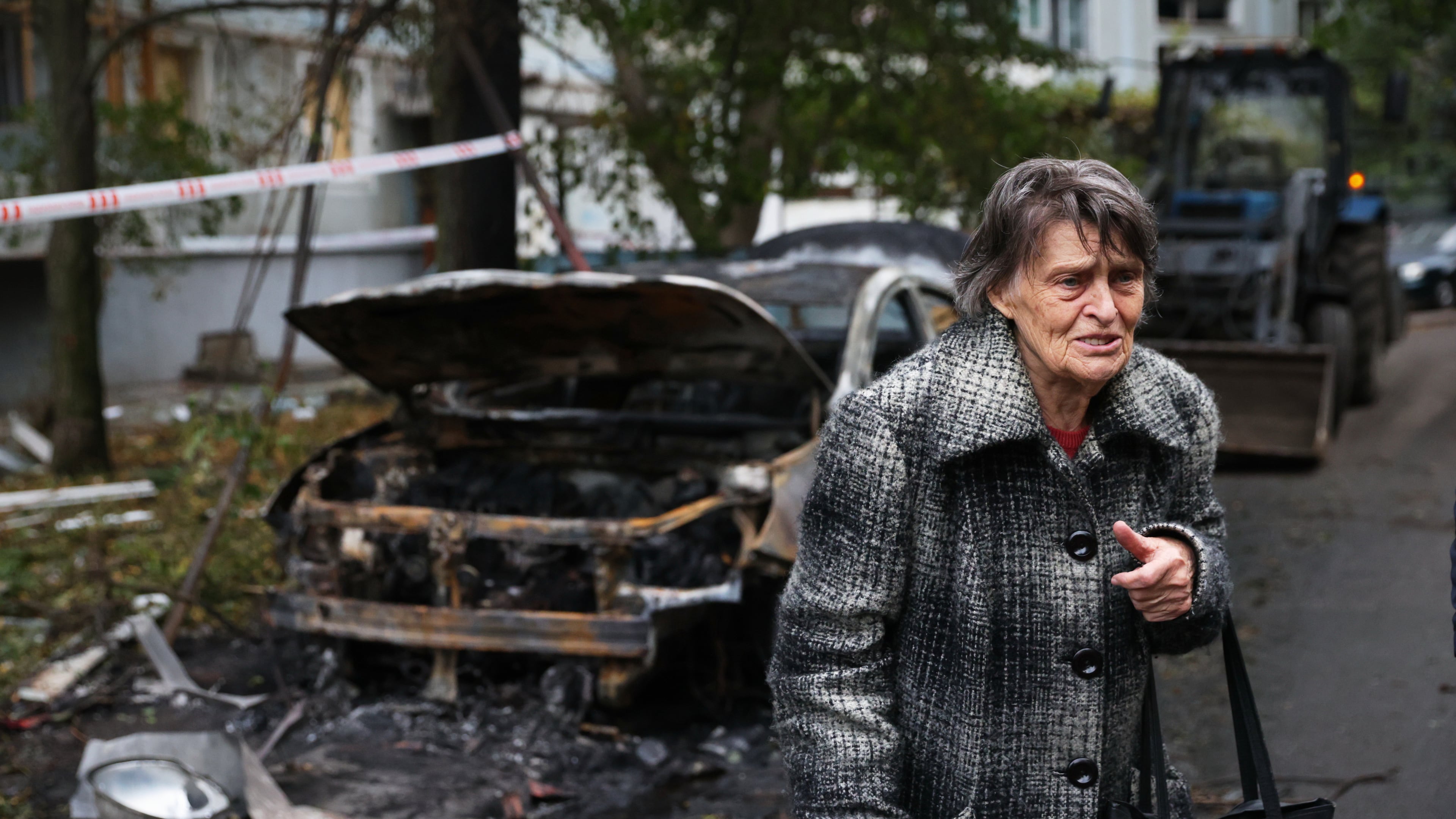 An elderly woman reacts next to the house destroyed by a Russian strike in Zaporizhzhia, Ukraine, Sunday, Oct. 5, 2025. (AP Photo/Kateryna Klochko)