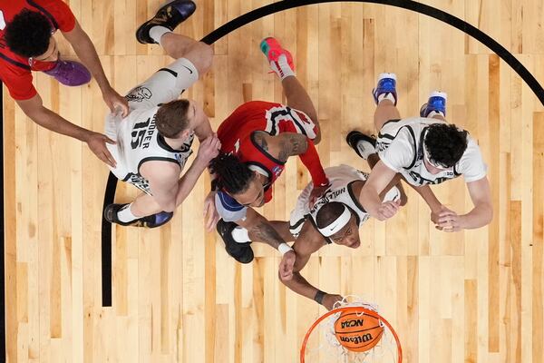 Michigan State guard Tre Holloman (5) shoots against Mississippi during the second half in the Sweet 16 of the NCAA college basketball tournament, Friday, March 28, 2025, in Atlanta. (AP Photo/Brynn Anderson)