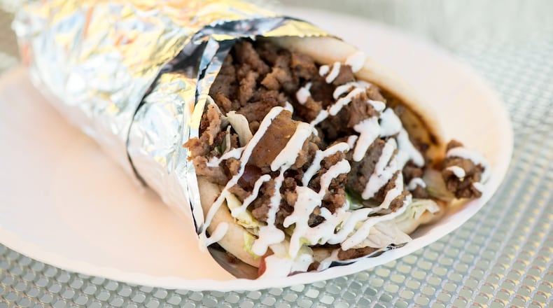 Beef gyro sandwich with special white sauce at the Halal Guys. The Halal Guys’ white sauce is legendary. CONTRIBUTED BY MIA YAKEL