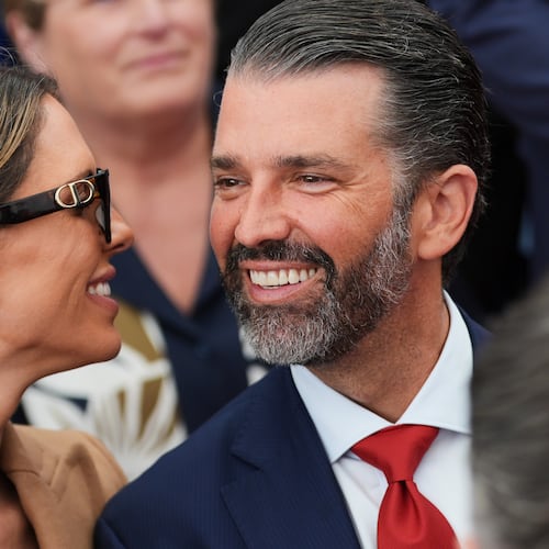 FILE - Donald Trump Jr., speaks with his wife Bettina, left, as they wait for President Donald Trump to deliver remarks to U.S. embassy staff at Deerfield Residence in Dublin, Sept. 12, 2026. (AP Photo/Julia Demaree Nikhinson, File)