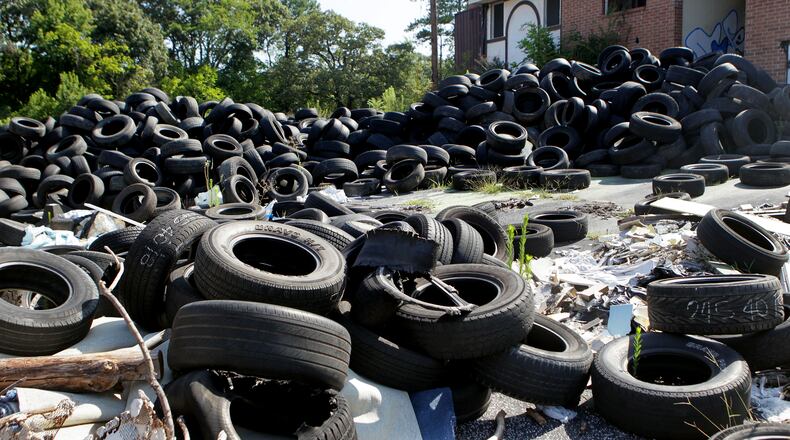 Georgia charges $1 for every new tire sold, and the money is supposed to be used to clean up dumps like this one in Atlanta. But much of the money is used for other purposes. Voters will decide whether to approve an amendment to the Georgia Constitution that would allow the General Assembly to dedicate such revenue to its intended purpose. PHIL SKINNER