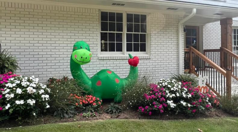 Tina Muirhead-Walden shows her support for the dinosaur cause by installing an inflatable in her yard. (Photo Courtesy of Tina Muirhead-Walden)