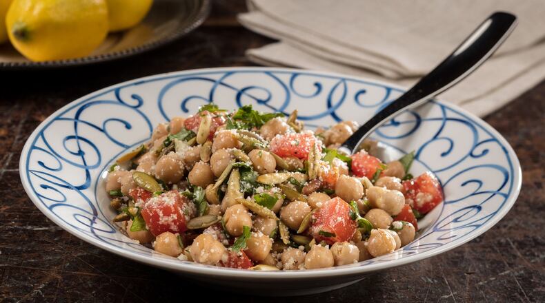Chickpeas are mixed with tomatoes, pumpkin seeds, parsley and Parmesan for a sunny salad. (Zbigniew Bzdak/Chicago Tribune/TNS)