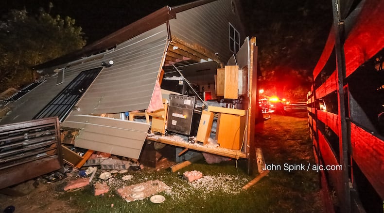 A train derailed and knocked a house off its foundation in northwest Atlanta.