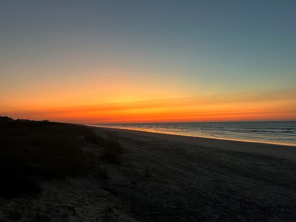 The sun rises over the ocean along a beach in Kiawah Island in South Carolina.