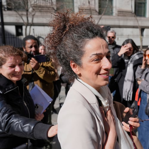 FILE - Masih Alinejad greets friends and supporters outside the federal courthouse after testifying at the trial of two men accused of allegedly plotting to kill her in New York, March 18, 2025. (AP Photo/Seth Wenig, File)