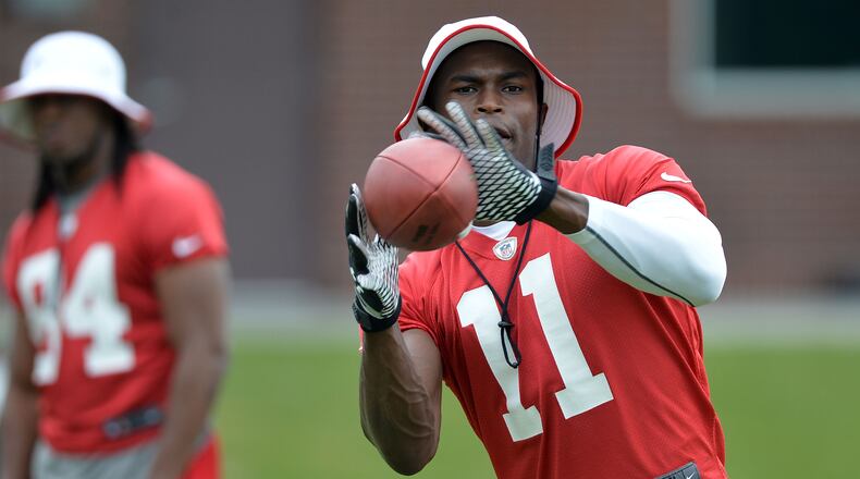 JUNE 18, 2014 FLOWERY BRANCH Falcons wide receiver catches a throw during the mini-camp. Atlanta Falcons players workout during the second day of mini-camp at the team's facilities in Flowery Branch, Wednesday, June 18, 2014. KENT D. JOHNSON/KDJOHNSON@AJC.COM Julio Jones is one player Falcons can't afford to lose. (Kent Johnson, AJC)