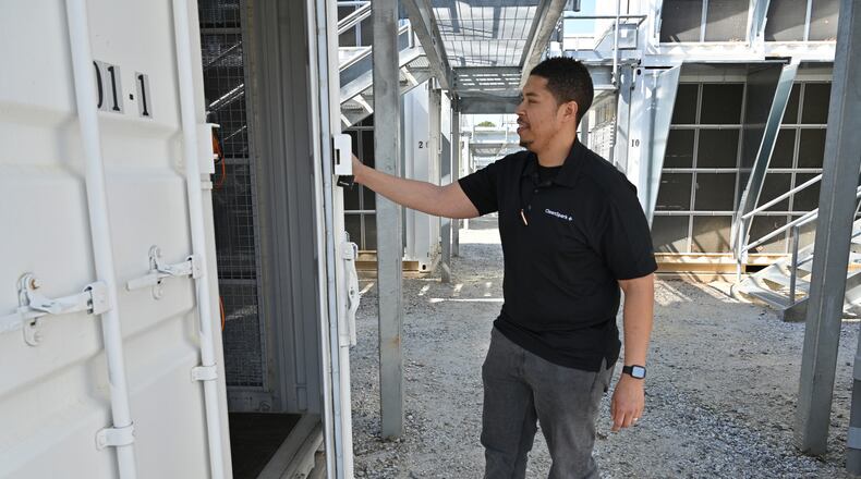 March 30, 2022 College Park - Jason Sanders, general manager, opens up one of units at Cleanspark Bitcoin Mining Facility in College Park on Wednesday, March 30, 2022. (Hyosub Shin / Hyosub.Shin@ajc.com)