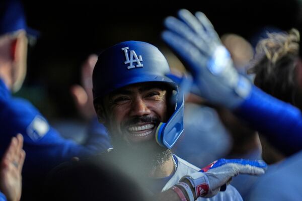 Los Angeles Dodgers right fielder Teoscar Hernández (37) celebrates after hitting a two-run home run during the fifth inning of a baseball game against the Chicago Cubs, Wednesday, April 23, 2025, in Chicago. (AP Photo/Erin Hooley)