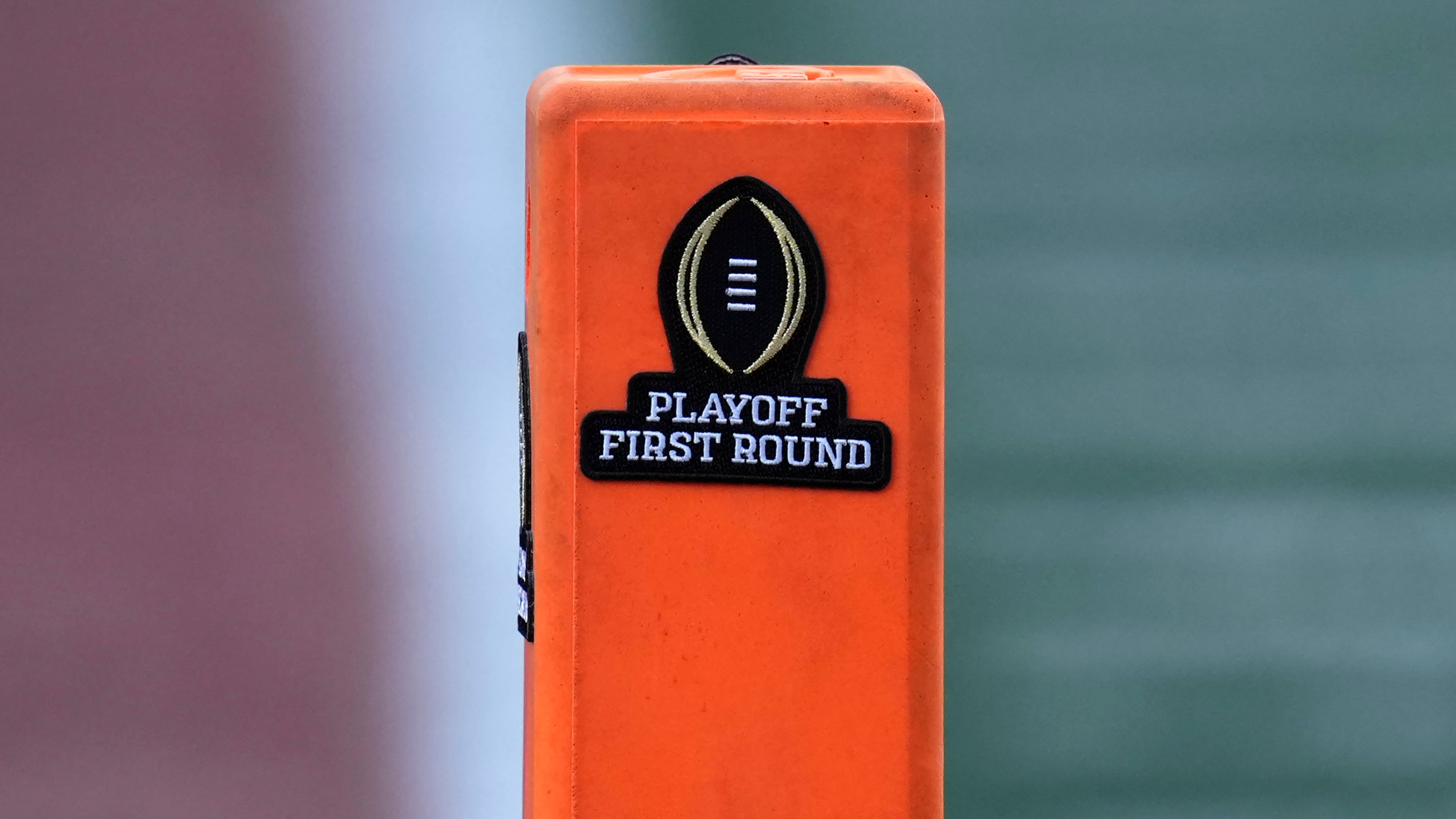 FILE - A playoff logo is seen on an end zone marker during the first half between Texas and Clemson in the first round of the College Football Playoff, Dec. 21, 2024, in Austin, Texas. (AP Photo/Eric Gay, file)