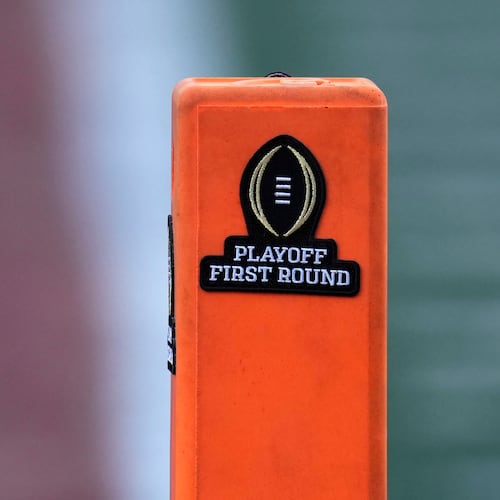 FILE - A playoff logo is seen on an end zone marker during the first half between Texas and Clemson in the first round of the College Football Playoff, Dec. 21, 2024, in Austin, Texas. (AP Photo/Eric Gay, file)