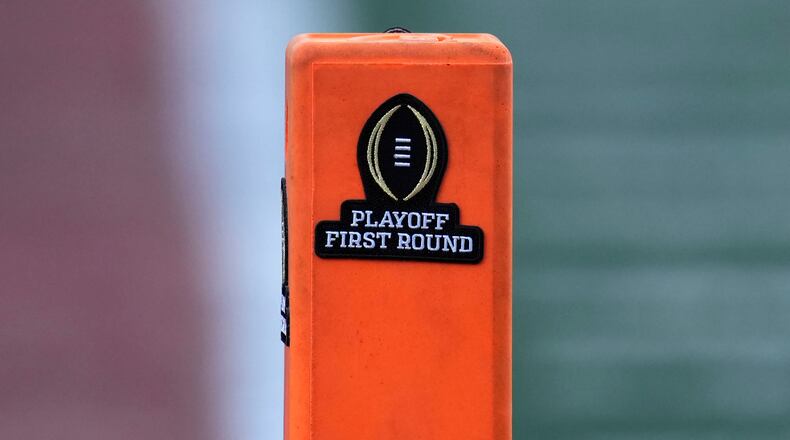 FILE - A playoff logo is seen on an end zone marker during the first half between Texas and Clemson in the first round of the College Football Playoff, Dec. 21, 2024, in Austin, Texas. (AP Photo/Eric Gay, file)