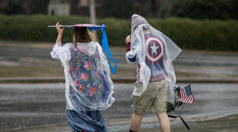 People make their way to the The Atlanta March for Social Justice & Women in the rain, Saturday, Jan. 21, 2017, in Atlanta. BRANDEN CAMP/SPECIAL