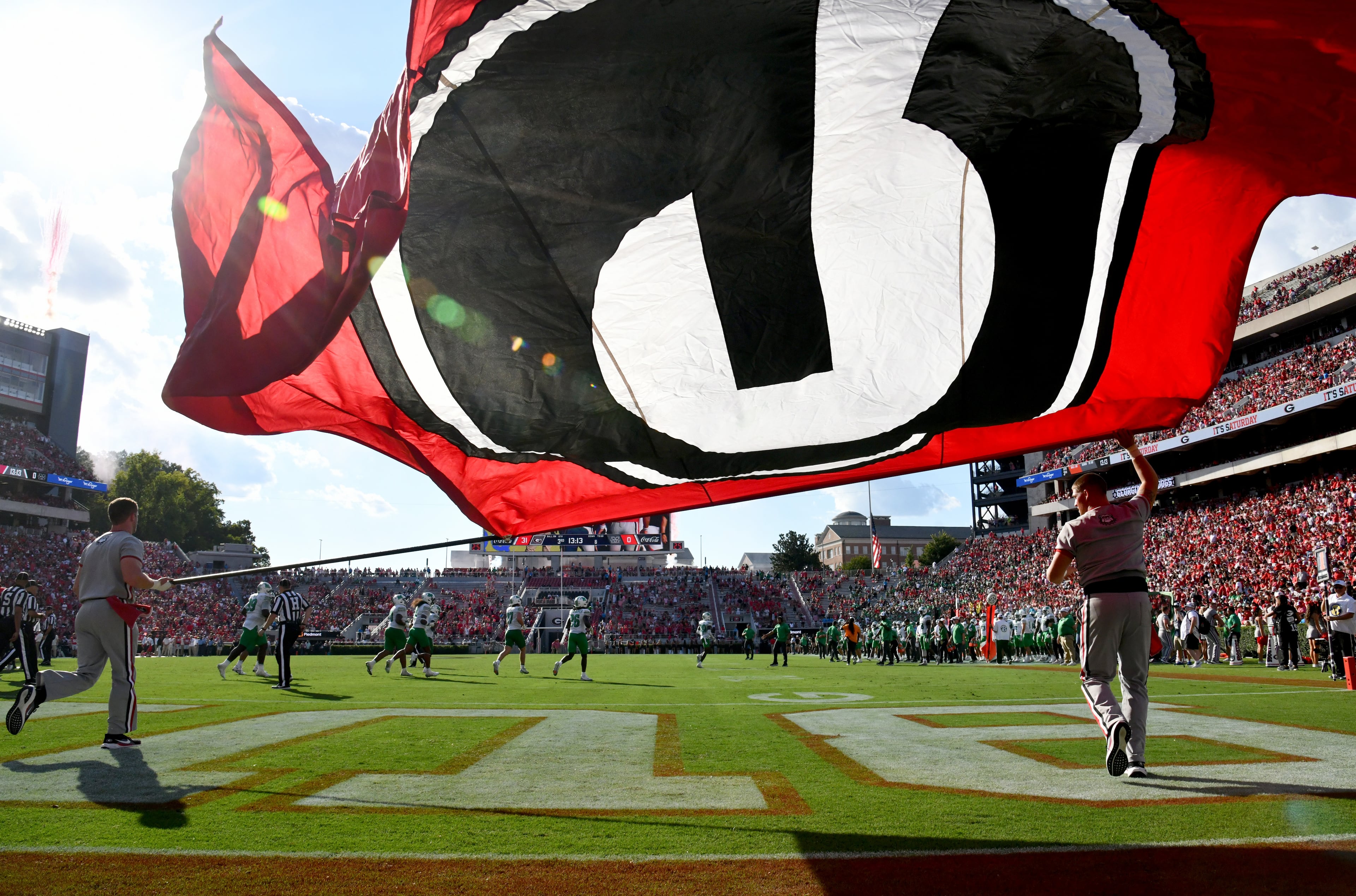 Georgia fans celebrate after wide receiver Zachariah Branch scored a touchdown during the second half in an NCAA football game at Sanford Stadium, Saturday, August 30, 2025, in Athens. Georgia won 45-7 over Marshall. (Hyosub Shin / AJC)