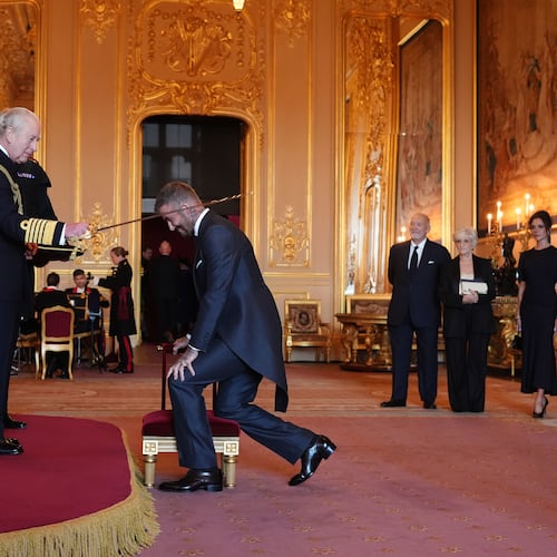 Sir David Beckham is made a Knight Bachelor by Britain's King Charles III during an Investiture ceremony at Windsor Castle, Berkshire, England, Tuesday, Nov. 4, 2025. (Jonathan Brady/PA via AP)