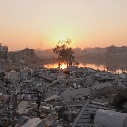 A Palestinian child walks through the destruction caused by the Israeli air and ground offensive in Sheikh Radwan neighborhood in Gaza City, Monday, Nov. 10, 2025. (AP Photo/Jehad Alshrafi)