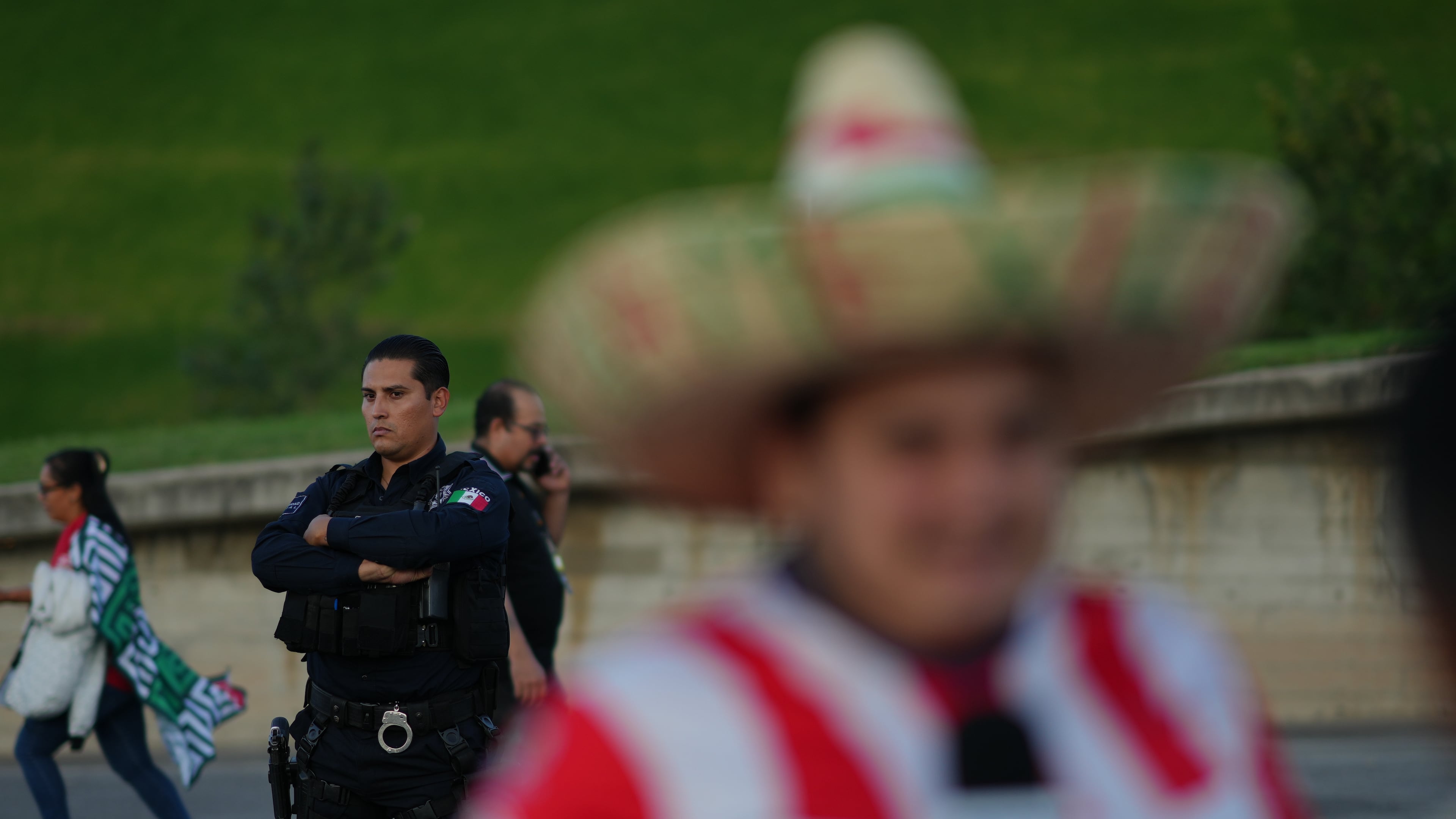 A police officer stands guard outside Akron Stadium prior to a friendly match between Mexico and Ecuador in Guadalajara, Mexico, Tuesday, Oct. 14, 2025. (AP Photo/Eduardo Verdugo)
