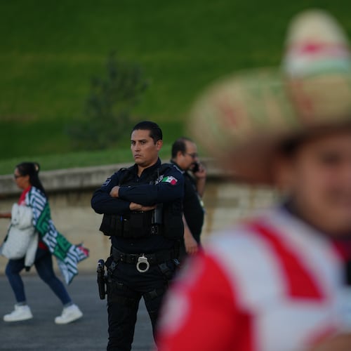 A police officer stands guard outside Akron Stadium prior to a friendly match between Mexico and Ecuador in Guadalajara, Mexico, Tuesday, Oct. 14, 2025. (AP Photo/Eduardo Verdugo)
