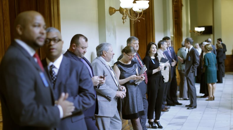 Registered lobbyists line the halls during the 2016 legislative session. Lobbyists in Georgia are required to register with the state ethics commission but some think many avoid doing so. BOB ANDRES / BANDRES@AJC.COM