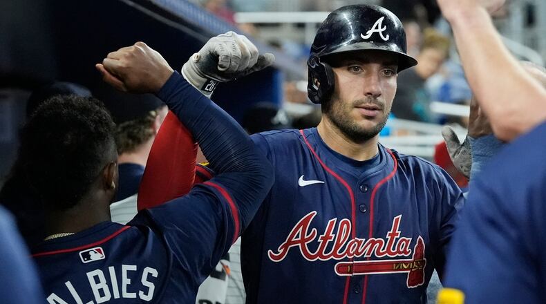 Atlanta Braves' Matt Olson celebrates a two-run home run during the seventh inning of a baseball game against the Miami Marlins, Saturday, Sept. 21, 2024, in Miami. (AP Photo/Marta Lavandier)