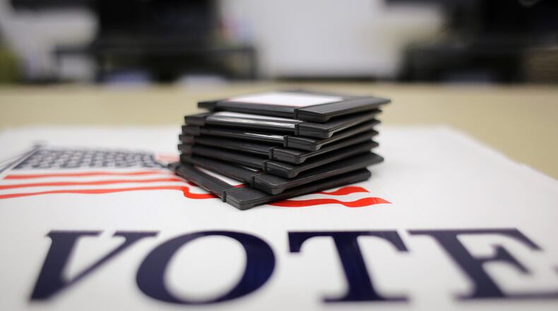 Residents in two new cities, South Fulton and Stonecrest, will cast ballots today for their first mayors and council members as voters across metro Atlanta go to the polls for local elections. (AP Photo/Eric Gay)