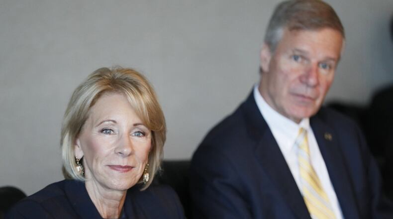 Betsy DeVos, U.S. Education Secretary, and G. P. “Bud” Peterson, Georgia Tech President, watch a presentation during DeVos’ visit to Georgia Tech on Wednesday. BOB ANDRES / BANDRES@AJC.COM