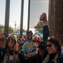 Festivalgoers hoist cold beers at SweetWater 420 Fest. (Courtesy of SweetWater Brewing Co.)