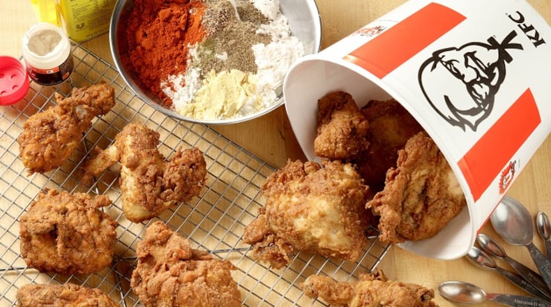 We didn't taste much of a difference between Kentucky Fried Chicken, right, and the fried chicken, left, on wire rack, we made in our test kitchen using a recipe that may - or may not - be Colonel Sanders' secret blend of 11 herbs and spices. (Michael Tercha/Chicago Tribune/TNS)