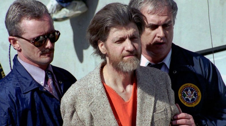 Ted Kaczynski is flanked by federal agents as he is led to a car from the federal courthouse in Helena, Montana on April 4, 1996. Kaczynski, who came to be known as the Unabomber, was arguably the most elusive suspect in the history of American criminal justice. Kaczynski, who tested the stamina of the FBI in one of the longest and expensive manhunts ever known, was captured on April 3, 1996 — 25 years ago today.