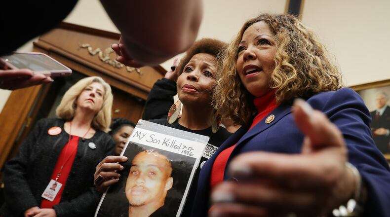 The Brady Campaign’s Mattie Scott (C) and Rep. Lucy McBath (D-GA), both of who lost sons to gun violence, pose for photographs before a hearing on gun violence legislation in the Rayburn House Office Building on Capitol Hill Feb. 06, 2019, in Washington, DC. Gun-control groups poured $4 million into McBath’s Georgia campaign, reflecting a resurgence of the anti-gun lobby in political giving. CHIP SOMODEVILLA / GETTY IMAGES