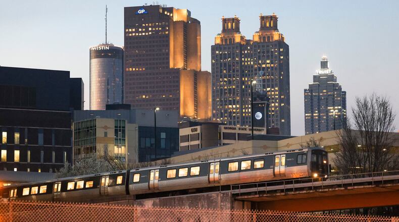 The Atlanta skyline in the background as a MARTA train leaves the Georgia State MARTA Station off of Piedmont Avenue on March 6, 2023, in Atlanta. (Jason Getz/The Atlanta Journal-Constitution/TNS)