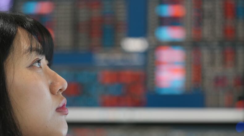 A dealer watches computer monitors at a dealing room of Hana Bank in Seoul, South Korea, Friday, May 15, 2026. (AP Photo/Lee Jin-man)