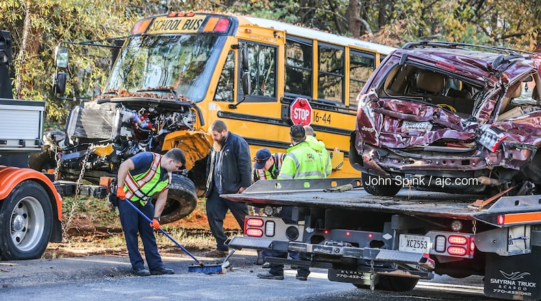 A Marietta City Schools bus and an SUV were seriously damaged in a head-on crash Thursday morning. Everyone involved, including four students, was able to walk away.