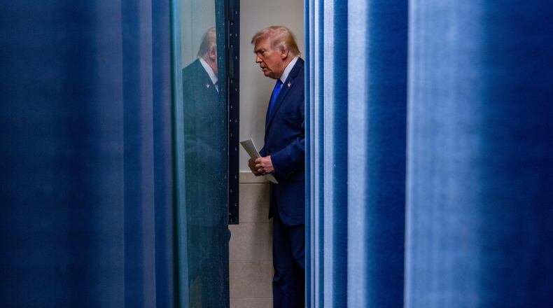 President Donald Trump arrives to speak with reporters in the James Brady Press Briefing Room at the White House, Friday, Feb. 20, 2026, in Washington. (AP Photo/Alex Brandon)