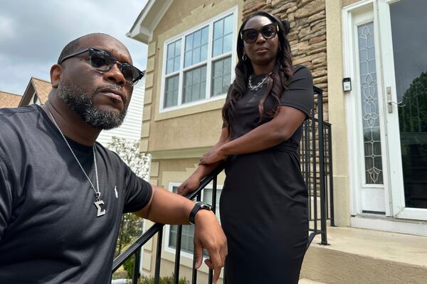 Toi Cliatt, left, and Trina Martin stand outside the home which the FBI mistakenly raided in 2017, in Atlanta on Friday, April 25, 2025. (AP Photo/Sudhin Thanawala)