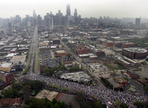 FILE - More than 300,000 demonstrators march to show support for immigrant rights in Chicago, May 1, 2006. (AP Photo/Jeff Roberson, File)