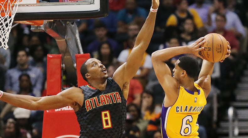 Hawks’ Dwight Howard defends against Lakers’ Jordan Clarkson during the second period in an NBA basketball game at Philips Arena on Wednesday, Nov. 2, 2016, in Atlanta. Curtis Compton /ccompton@ajc.com