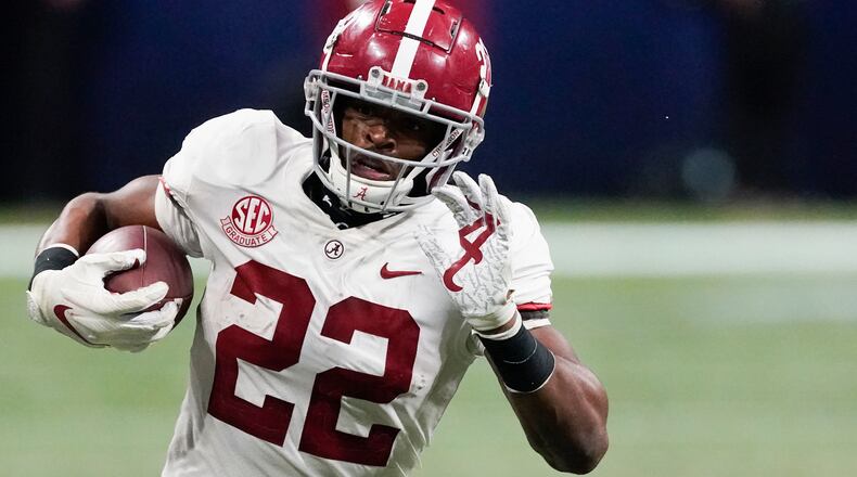 Alabama running back Najee Harris (22) runs against Florida during the second half of the Southeastern Conference championship game, Saturday, Dec. 19, 2020, at Mercedes-Benz Stadium in Atlanta. (John Bazemore/AP)