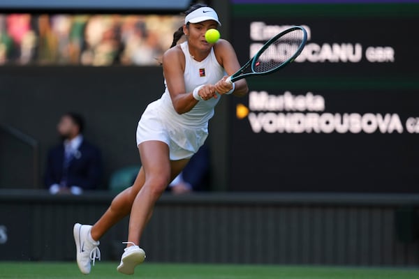 Emma Raducanu of Britain plays a return to Marketa Vondrousova of the Czech Republic during their second round women's singles match at the Wimbledon Tennis Championships in London, Wednesday, July 2, 2025.(AP Photo/Kirsty Wigglesworth)