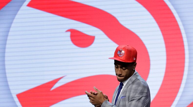 John Collins walks off the stage after being selected by the Atlanta Hawks as the 19th pick overall during the NBA Draft, Thursday, June 22, 2017, in New York.