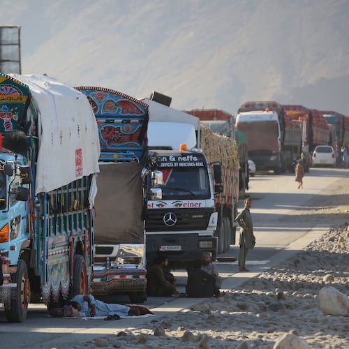 A line of cargo trucks bound for Pakistan is stranded on the Afghan side of the Torkham border crossing, which remained closed after clashes, in Nangarhar province, Afghanistan, Tuesday, Oct. 14, 2025. (AP Photo/Wahidullah Kakar)