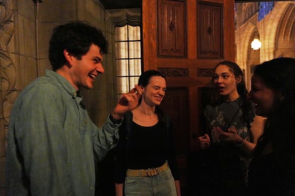 Members of the Aquinas Institute, Princeton University’s Catholic campus ministry, talk after attending a Mass at the school's chapel in Princeton, N.J., on Friday, May 16, 2025. (AP Photo/Luis Andres Henao)