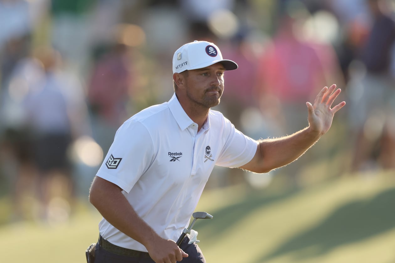 Bryson DeChambeau acknowledges patrons after his birdie putt on 18th hole during third round of the Masters golf tournament, at Augusta National Golf Club, Saturday, April 12, 2025, in Augusta, Ga. (Jason Getz / AJC)