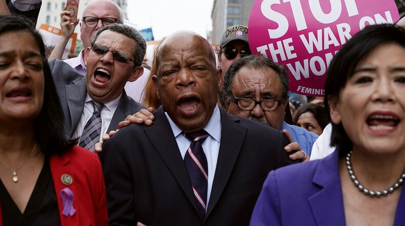 U.S. Rep. John Lewis (D-Atlanta), colleagues and activists march to the headquarters of U.S. Customs and Border Protection during a protest on June 13, 2018 in Washington, D.C. (Photo by Alex Wong/Getty Images)