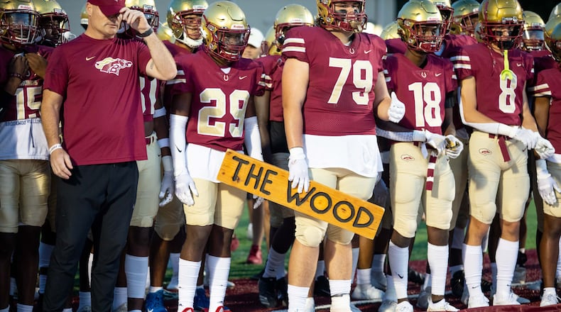 Brookwood's JT Hill (79) holds a sign that reads "THE WOOD" during a GHSA high school football game between Mountain View and Brookwood at Brookwood High School in Snellville, GA., on Friday, Oct. 1, 2021. (Photo/Jenn Finch)
